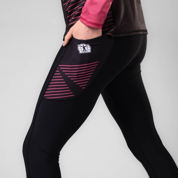 A pair of black athletics women's tights with pink and purple geometric patterns on the side pockets.