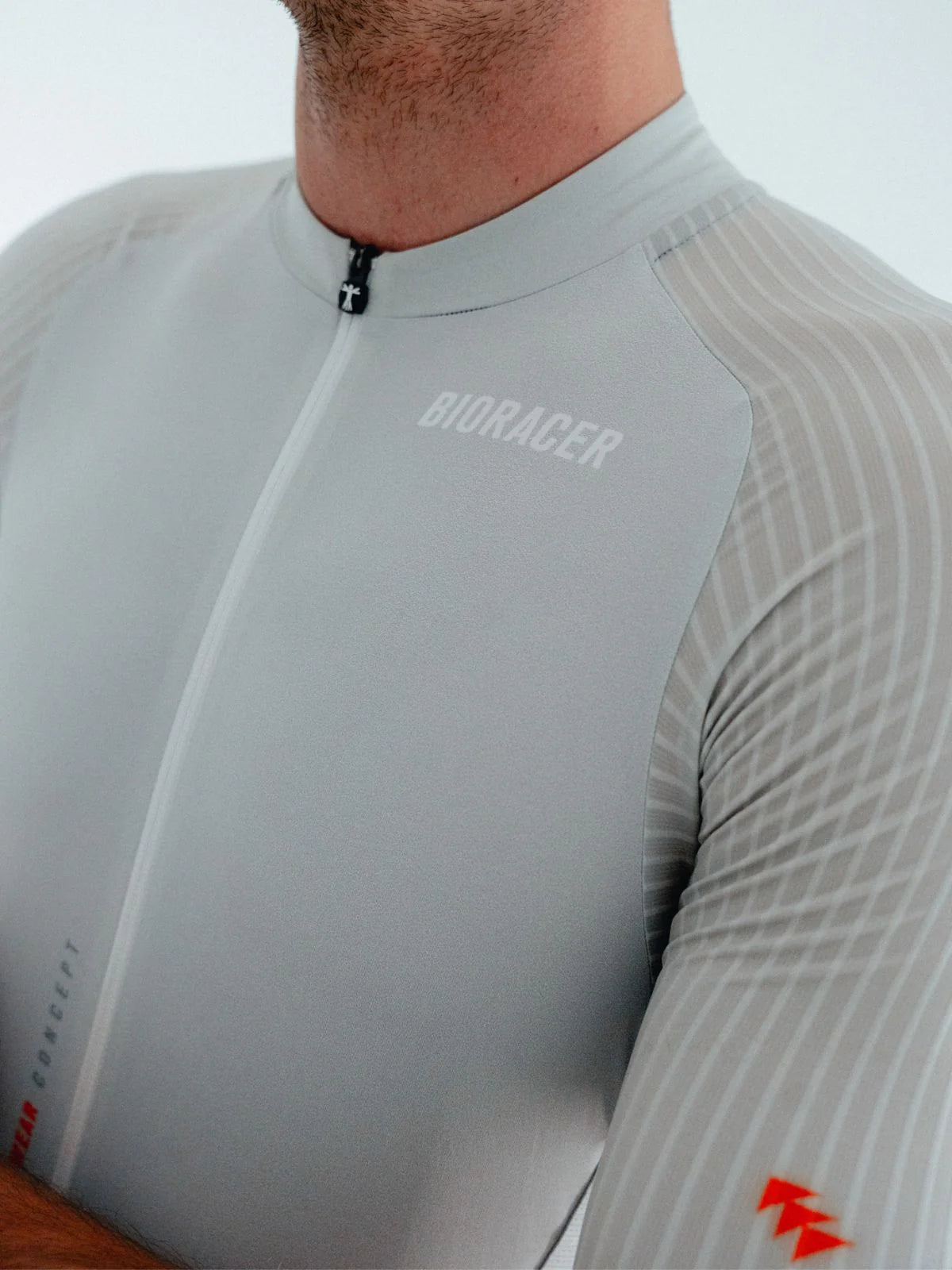 Gray cycling jersey with 'Bioracer' branding on a white background